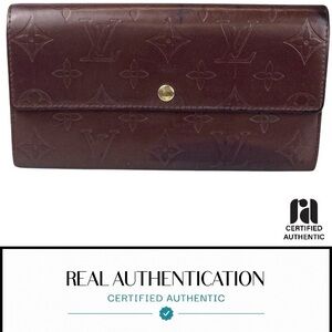 Genuine Louis Vuitton Monogram Matte 
Amarante Sarah Brown Embossed Wallet  COA